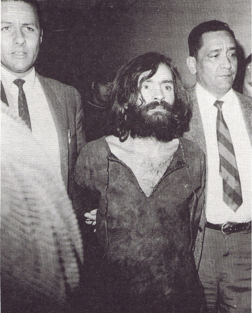 Manson escorted to court in Independence, California. He became a cult hero to many confused radicals during and after the murder trial but Manson was a PR disaster for the genuine goals of the counterculture. WIDE WORLD PHOTOS